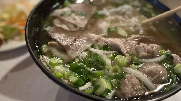 5 Steak & Meatballs Pho · Beef noodle soup with sliced rare steak, beef meatballs, onions, and scallions.