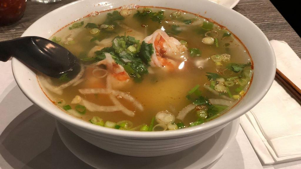 2 Seafood Pho · Noodle soup with fish balls, green mussels, squid, shrimp, imitation crab, onions, and scallions.