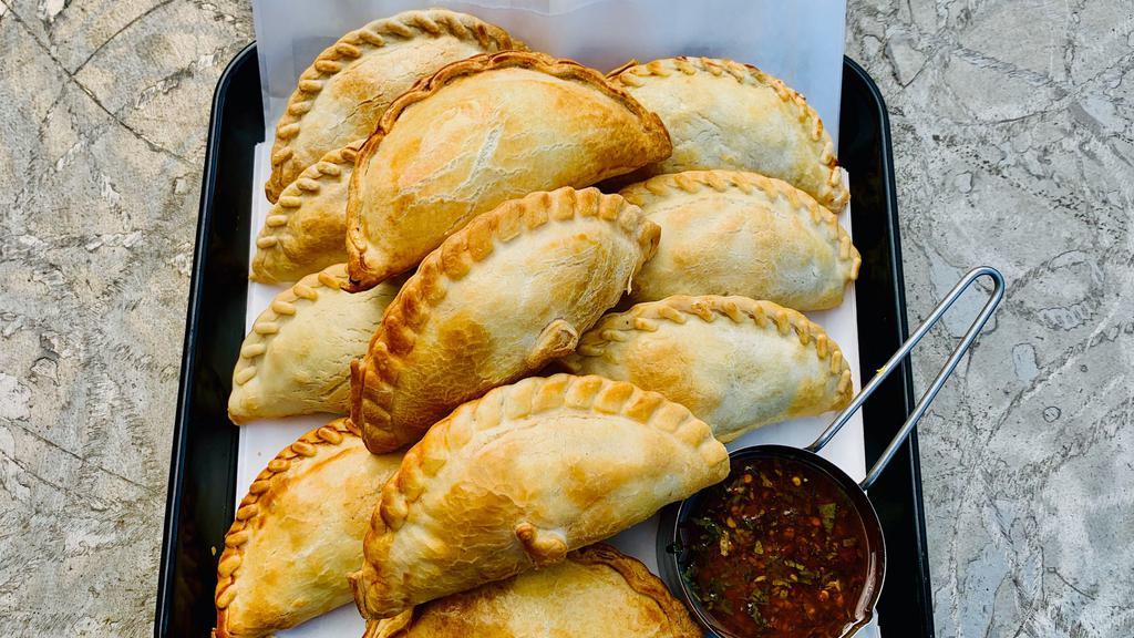 One Dozen Special · 12 Empanadas mix and match from any flavors. Save $10 from original price. 

*This offer includes  a mix of our favorites flavors for you to enjoy. This special includes Salsa chimichurri. *

*NO DRINKS INCLUDED
