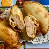 Ham & Cheese - Jamon · This is a kid favorite. Empanada baked to perfection filled with lean cooked ham and a mouth...