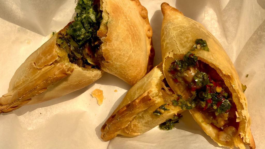 Vegan Kale & Butternut Squash · Earthy and well-balanced vegan empanadas. Filled with organic, freshly-cut kale, sautéed with onions and roasted butternut squash.
