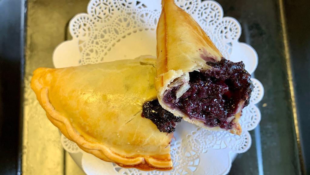 Blueberry Crisp Hand Pie · Filled with  fresh & sweet blueberries and  sweetened with a little brown sugar. Served with a twist from a zesty lemon touch.