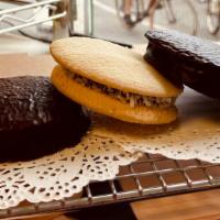 Argentinian Alfajores Mix & Match (3) · Three traditional argentine cookies filled with dulce de leche. Flavors: Chocolate & Traditi...