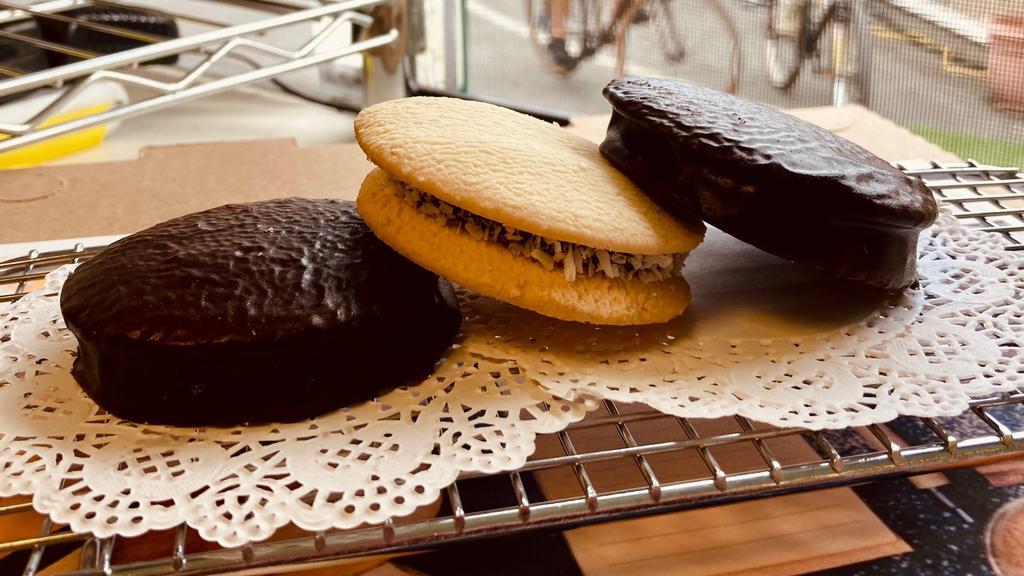 Argentinian Alfajores Mix & Match (3) · Three traditional argentine cookies filled with dulce de leche. Flavors: Chocolate & Traditional.