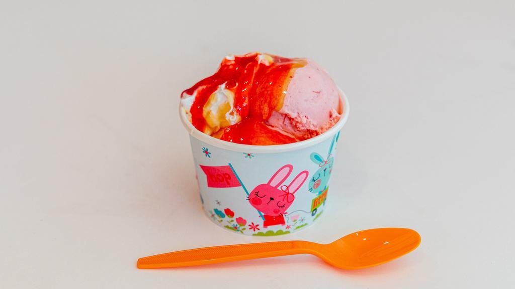 Strawberry-Mango Surprise · Strawberry ice cream, alphonso mango ice cream, strawberry sauce, graham cracker crumbs, roasted pecans, and whipped cream.