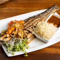 Shoukuya Cancancan ® Sea Bass · Whole sea bass with bones. Marinated in our proprietary flavorful sauce and grilled in a  ta...