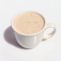 Rooibos Chai Latte · Caffeine free. Spiced tea stead with milk and sweetened.