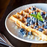 Fresh Blueberry Waffle · With lemon creme fraiche.