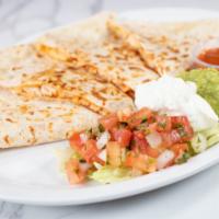 Quesadilla · Flour tortilla, folded over and filled with melted white cheese.  Guacamole and Sour cream o...