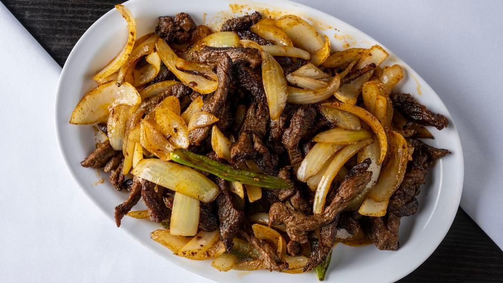 13. Mild Zilzil Tibbs · Lady fingered top round stir fried with traditional spices onion and garlic.