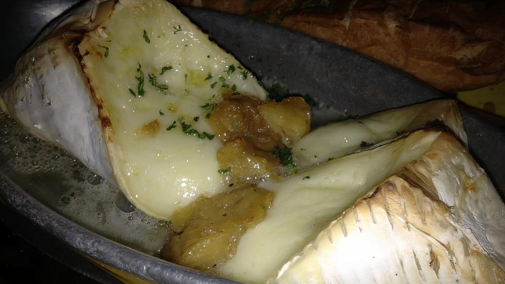 Baked Brie · With roasted garlic and house bread.