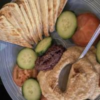 Hummus & Tapenade Plate · Served with warm pita bread, tomatoes and cucumbers.