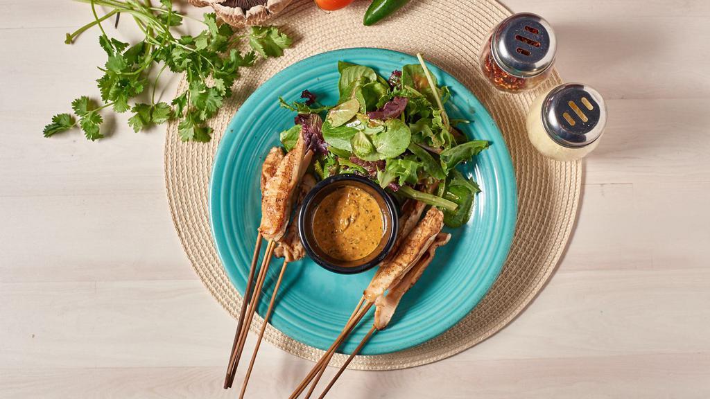 Chicken Skewers · With peanut dipping sauce. Served with mixed greens.