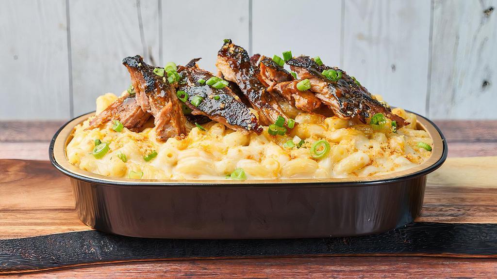 BBQ Pulled Pork Mac · Topped with curry cornbread crumble and scallions. Contains gluten, dairy, soy, shellfish, eggs, and coconut. We cannot make substitutions.