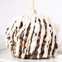 Pecan Bear Caramel Apple · A granny smith apple covered in fresh caramel then rolled in chopped pecans, drizzled in mil...
