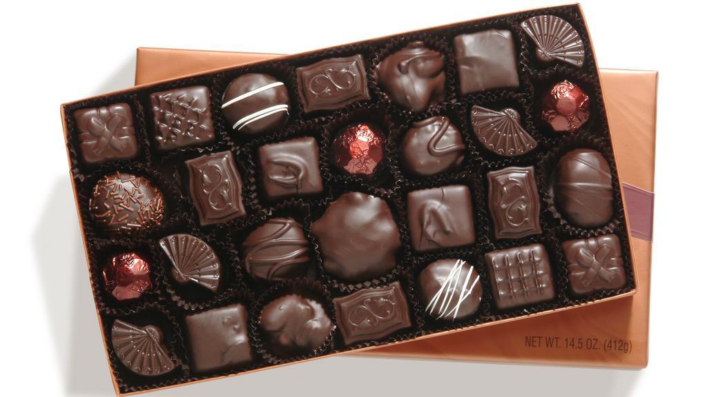 Dark Chocolate Assorted Box 14.5 oz. · For the true dark chocolate connoisseur, a selection of dark chocolate butter creams, dark chocolate nut clusters and caramels, plus our signature Dark Bear® pecan and caramel patties, all coated heavily in our rich, semi-sweet dark chocolate.