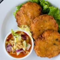 Kao Pode Tod · Thai spiced corn cakes served with cucumber relish & peanuts
