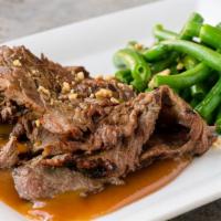 Praram Rong Song · Grilled marinated skirt steak served with curried peanut sauce and green beans