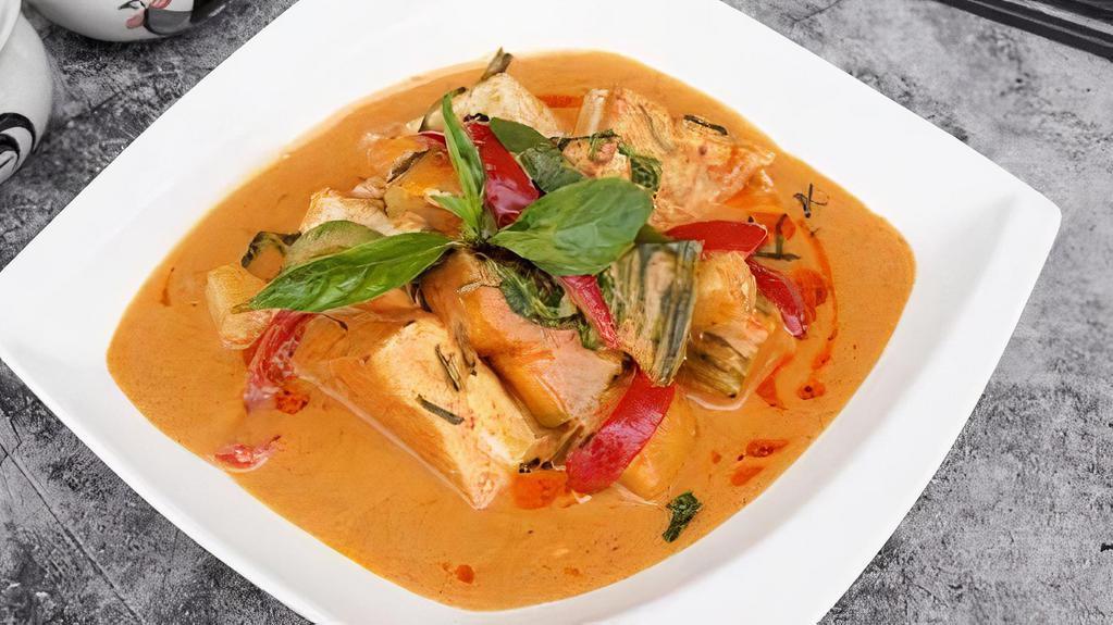 Pumpkin Curry Tofu · Golden tofu, Japanese pumpkin, bell peppers & basil in tangy red curry