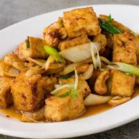 Pad Tofu · Golden bean cakes sauteed with onions scallions, & cashews in mild roasted chili sauce