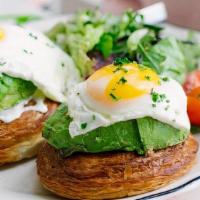 Avocado Croissant Egg Toast · Two sunny side up eggs with avocado and crème fraîche on croissant rolls. Served with season...