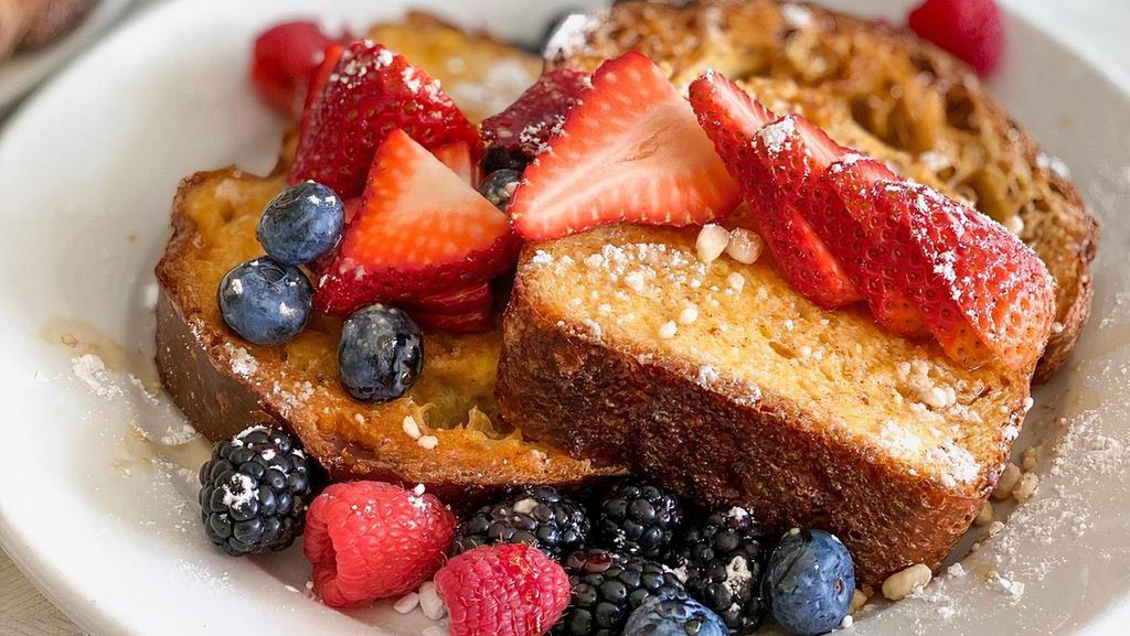 French Toast with Fruit and Nutella · House baked brioche, bananas, berries, and nutella.