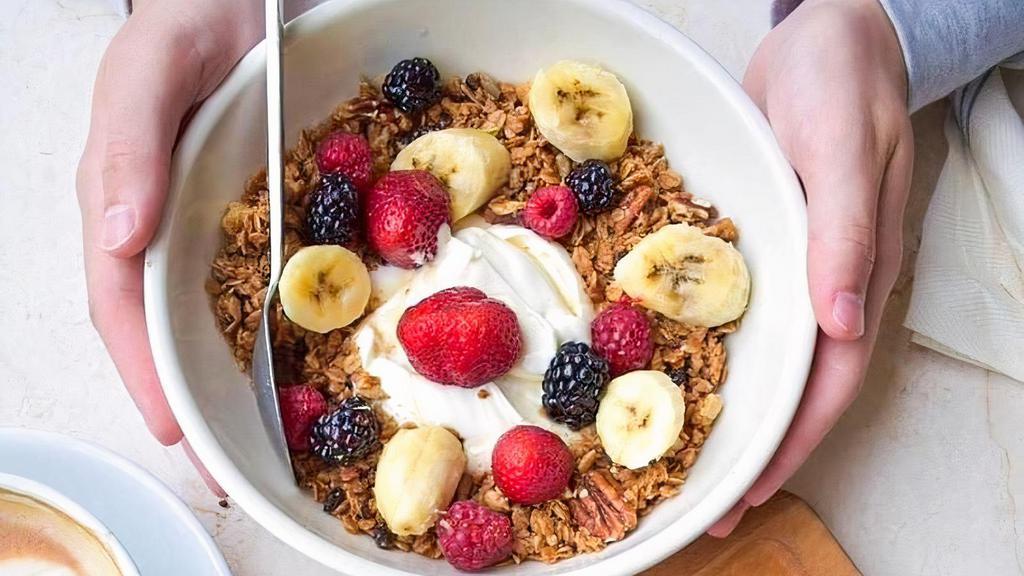 Yogurt Bowl with fruit, honey, granola, and yogurt · Bowl with fruit, honey, granola, and yogurt