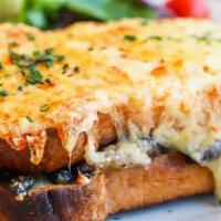 Croque Monsieur with Salmon · Cheese croque with salmon, gruyère cheese, and béchamel sauce on house baked pain de mie bre...