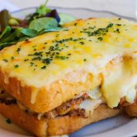 Croque Monsieur with Chicken · Cheese croque with chicken, gruyère cheese, and béchamel sauce on house baked pain de mie br...