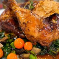 Family Style Whole Chicken Poulet Roti · Whole roasted chicken, pommes frites, roasted market vegetables, harissa sauce