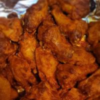 Spicy And Baked Buffalo Wings · Served with 8 pieces. Spicy.