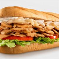 Chicken Philly Cheesesteak · Thin slices of white meat chicken, melted cheese and grilled onions on toasted bread and ser...