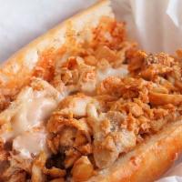 Buffalo Chicken Philly Cheesesteak · Thin slices of white meat chicken smothered in buffalo sauce, cheese and grilled onions on t...