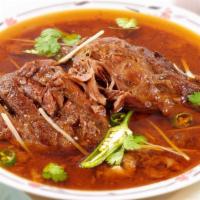 Beef Nihari · Marinated boneless beef cooked with special spices to make a dark brown curry.