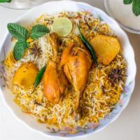 Chicken Biryani · Basmati rice marinated with Indian spices and chicken.