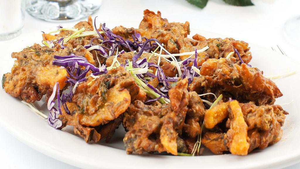 Vegetable Pakoras · Farmers market seasonal vegetables dipped in chickpea batter, ginger garlic, and Indian spices.