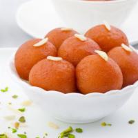 Gulab Jamun · A sweet consisting of milk based dumplings soaked in sugar syrup.