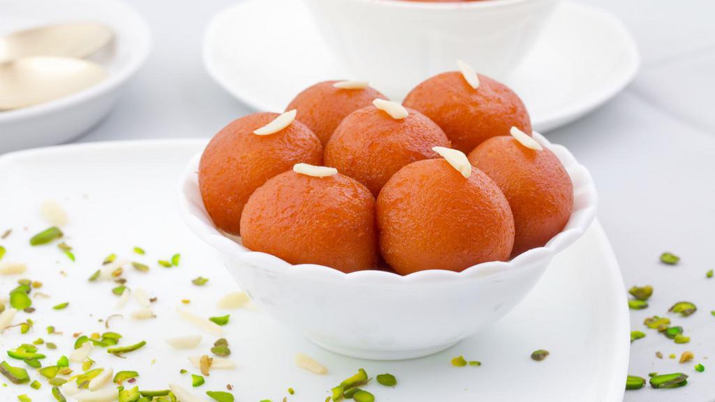 Gulab Jamun · A sweet consisting of milk based dumplings soaked in sugar syrup.