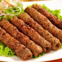 Chicken Seekh Kebab · Flavorful chicken topped with with fennel, herbs, and spices.
