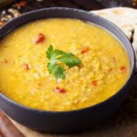 Yellow Tarka Dal · Cooked lentils tempered with indian spices and herbs.