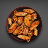 18 Classic Bone-in Wings · 18 classic bone in traditional  breaded wings served in your choice of wing flavor with your...