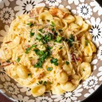 Lobster Mac 'n' Cheese · orecchiette pasta with lobster, smoked bacon, quattro formaggi, shallot cream, and herb brea...