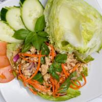 Lettuce Wrap Salad · Ground chicken, lettuce, cilantro, lemongrass mint, red onion, and Thai chili.