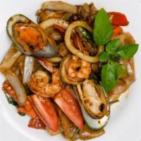 Drunken Noodles · Stir fried rice, flat noodles, carrot, green bean, bell pepper, basil, yellow onion and garl...