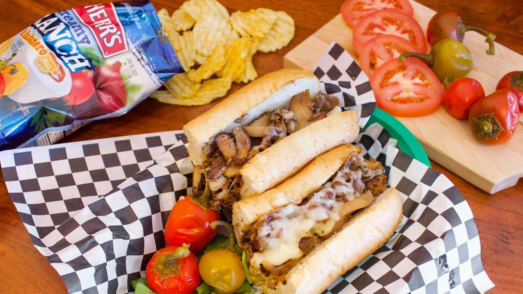 GMO Cheesesteak · Grilled steak, roasted garlic, melted provolone cheese, mushrooms & grilled onions