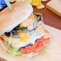 Jake's Monster Cheese Burger · Beef patty topped with lettuce, tomatoes, house sauce, pickles, onions