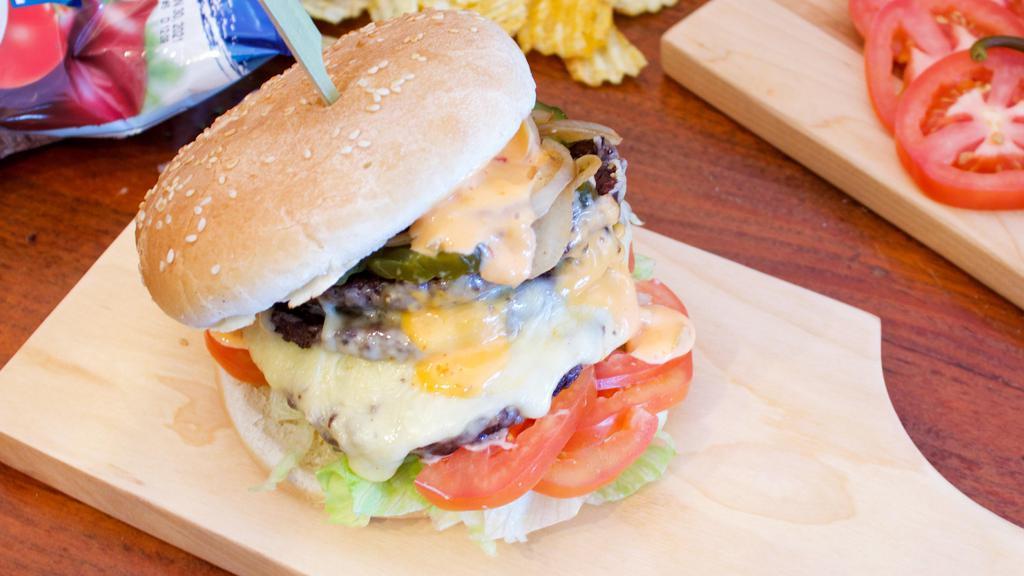 Jake's Monster Cheese Burger · Beef patty topped with lettuce, tomatoes, house sauce, pickles, onions