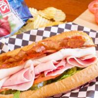 Jake's Club Sandwich · Ham, turkey, bacon & with muffuletta (olive spread), choice of cheese topped lettuce, tomato...