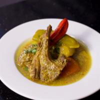 Lamb Mosli · Lamb tagine and mixed vegetable in a turmeric sauce with preserved lemon and green olives.