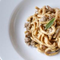 Passatelli alla Salsiccia · Parmigiano, egg and breadcrumb pasta sautéed with housemade Italian sausage, butter, sage & ...